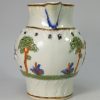 Prattware pottery jug, Military Review, decorated with enamels under a pearlware glazer, circa 1810