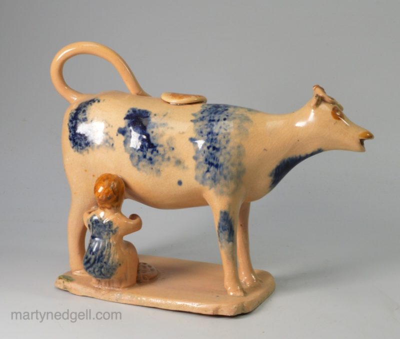 Buff coloured pottery cow creamer, circa 1820