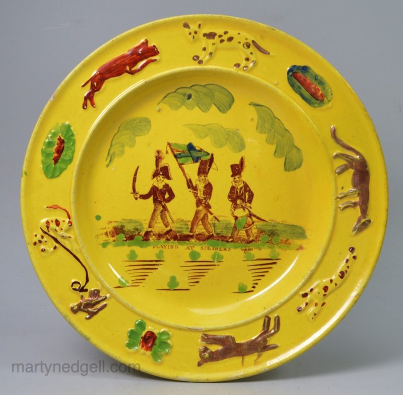 Canary yellow child's plate "Playing at Soldiers", circa 1820
