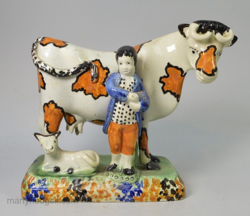 Yorkshire type prattware pottery cow and attendant, circa 1820