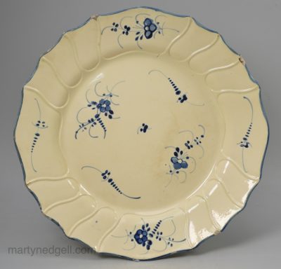 Creamware pottery plate decorated with blue under the glaze, circa 1790