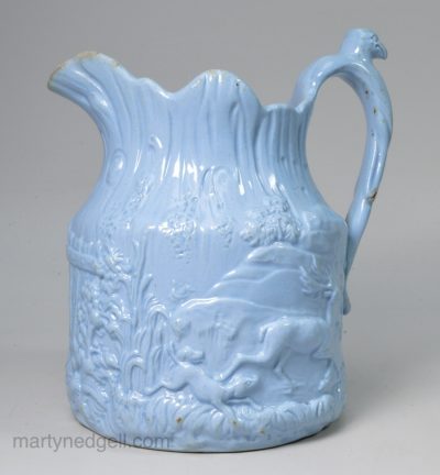 Blue pottery relief moulded jug, circa 1850