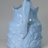 Blue pottery relief moulded jug, circa 1850