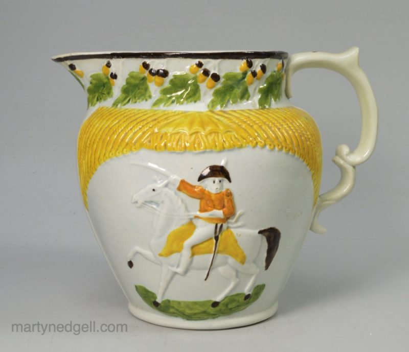 Prattware pottery jug moulded with Wellington on horseback, circa 1815