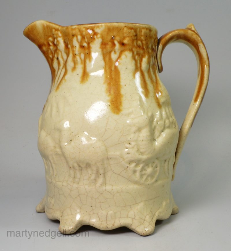 Pottery jug moulded with circus animals, circa 1870