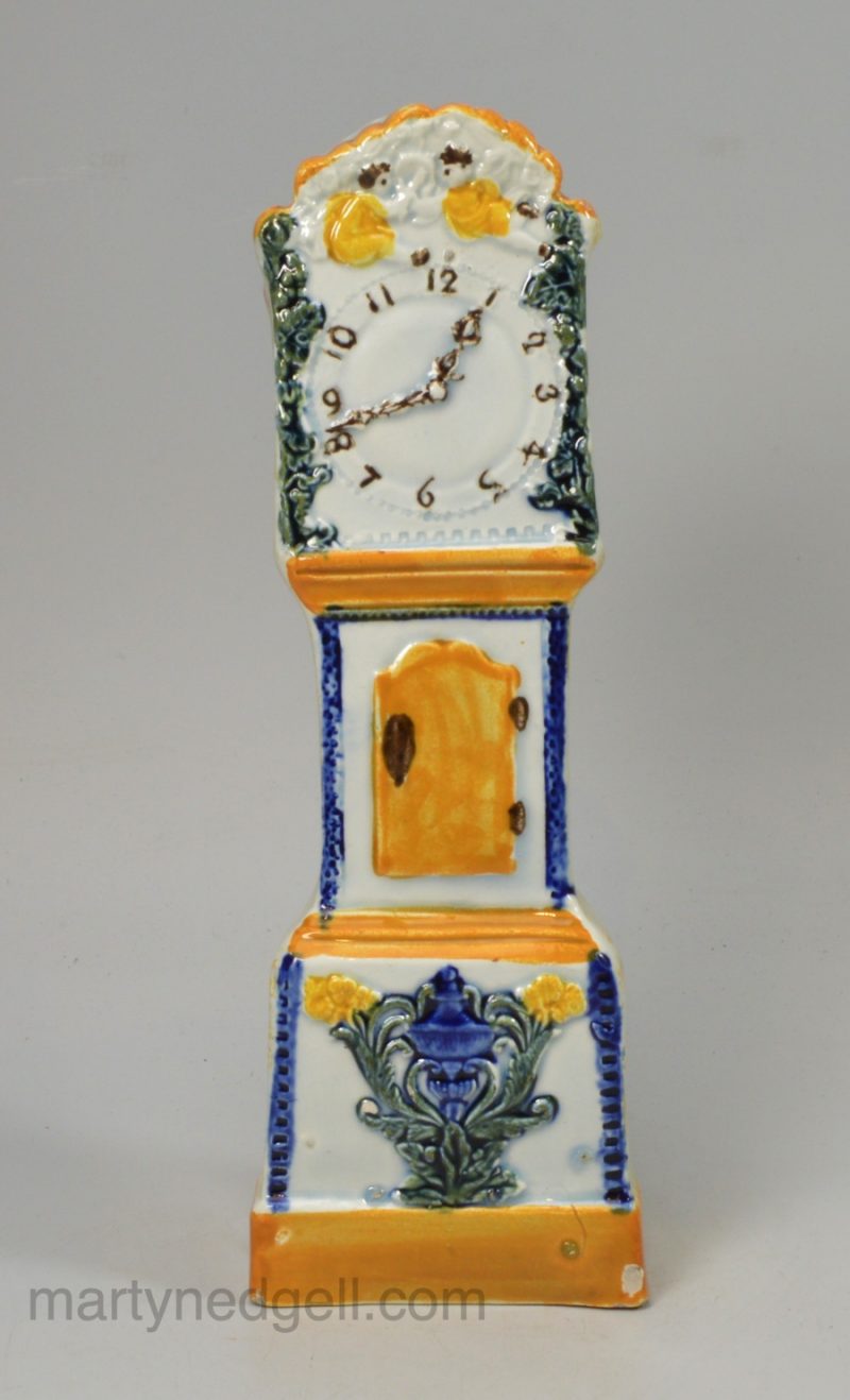 Prattware pottery long case clock, decorated with colours under a pearlware glaze, circa 1820