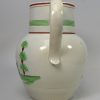 Pearlware pottery jug decorated with a bird in colours over the glaze, circa 1810