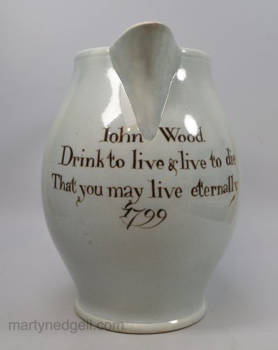 Large pearlware pottery jug decorated with a verse and name under the glaze, dated 1799