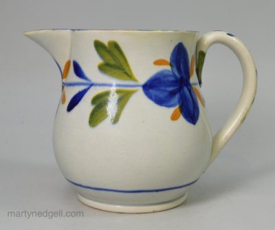 Small prattware pottery jug decorated in colours under a pearlware glaze, circa 1820