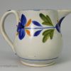 Small prattware pottery jug decorated in colours under a pearlware glaze, circa 1820