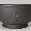 Black basalt bowl sprigged with classical figures, circa 1800