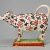 Pearlware pottery cow creamer decorated with over glaze enamels, circa 1830