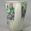 Pearlware pottery Bacchus mug decorated with colours under the glaze, circa 1790