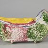 Pearlware pottery toy cradle with baby, sponge decorated, circa1830