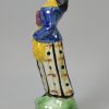 Prattware pottery figure decorated with enamels under a pearlware glaze, circa 1800