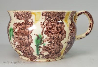 Large creamware pottery mug decorated with Whieldon type colours under the glaze, circa 1780