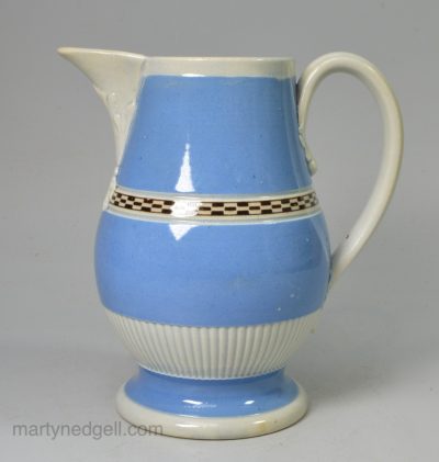 Pearlware pottery serving jug decorated with blue and brown slip, circa 1800