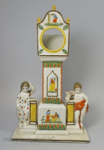Pearlware pottery watch stand decorated with Prattware colours under the glaze, circa 1820