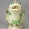 Creamware pottery dolphin sauce boat decorated with underglaze oxides of green and manganese, circa 1780