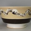 Mochaware pottery bowl with snail trail decoration, circa 1830