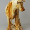 Creamware pottery cow creamer decorated with brown under the glaze, circa 1830