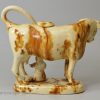 Creamware pottery cow creamer decorated with brown under the glaze, circa 1830