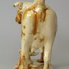 Creamware pottery cow creamer decorated with brown under the glaze, circa 1830