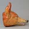 Oversize pearlware pottery fox head stirrup cup decorated with enamels over the glaze, circa 1820