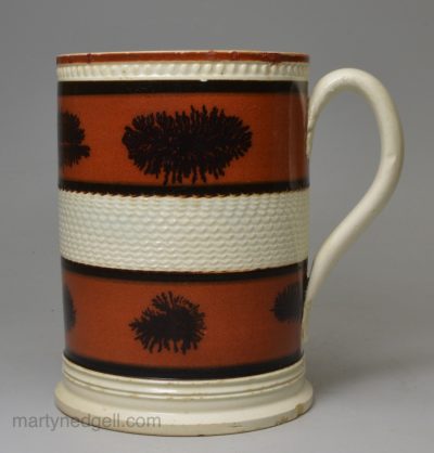 Mochaware pottery mug decorated with engine turning and dendritic on slip, circa 1820