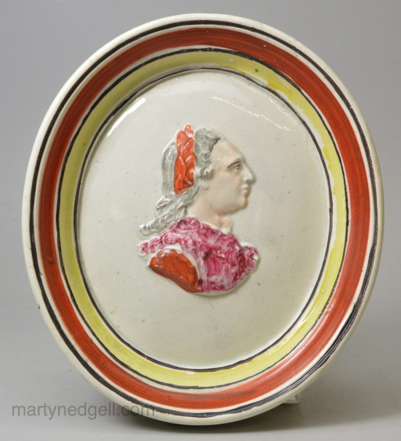 Pearlware pottery plaque moulded with the head of George III, circa 1800