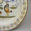 Prattware pottery plate decorated with a cock fighting scene, circa 1820