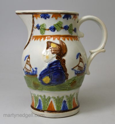 Commemorative prattware pottery jug moulded with a profile of Admiral Duncan, circa 1800