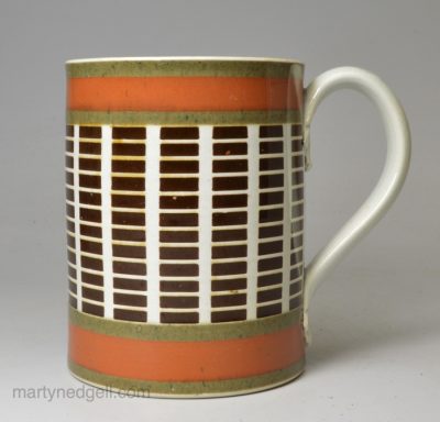 Mochaware mug with inlaid decoration under a pearlware glaze, circa 1800