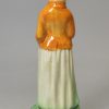 Prattware pottery figure of a woman with a goose, circa 1800