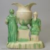 Creamware pottery figural spill vase decorated with green under the glaze, circa 1770