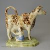 Creamware pottery cow creamer decorated with colours under the glaze, circa 1800