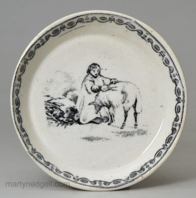 Small pearlware pottery dish printed with someone sheering a sheep, circa 1840