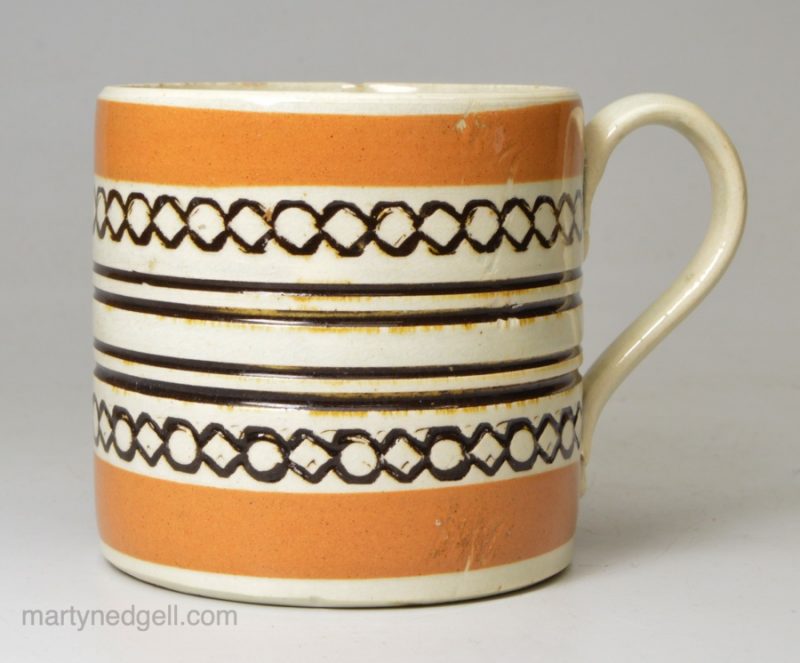 Mochaware mug decorated with inlaid slip, circa 1820