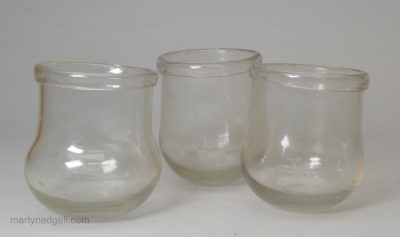 Three early 19th century cupping glasses with folded rims and ground off pontils