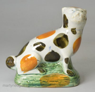 Prattware pottery pug decorated with high fired enamels under a pearlware glaze, circa 1800