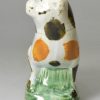 Prattware pottery pug decorated with high fired enamels under a pearlware glaze, circa 1800