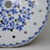 London delft drainer decorated with flowers in blue, circa 1750