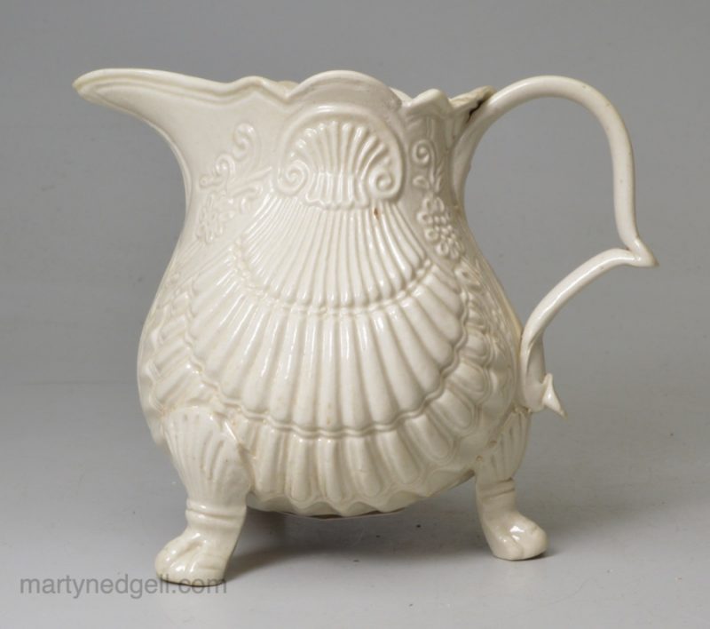 Staffordshire white. saltglaze stoneware pectin shell moulded jug, circa 1750