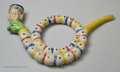 Pearlware pottery novelty pipe decorated with enamels over the glaze, circa 1820