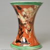 Mochaware spill vase decorated with combed slip on a creamware pottery body, circa 1820