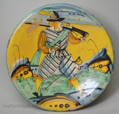 Montelupo tin glazed dish painted with soldier, circa 1670