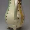 Creamware pottery milk jug decorated with slashes of colour under the glaze, circa 1770