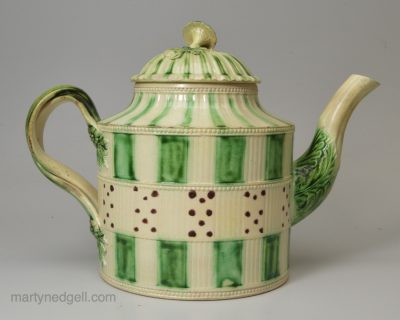 Creamware pottery teapot decorated with colours under the glaze, circa 1770
