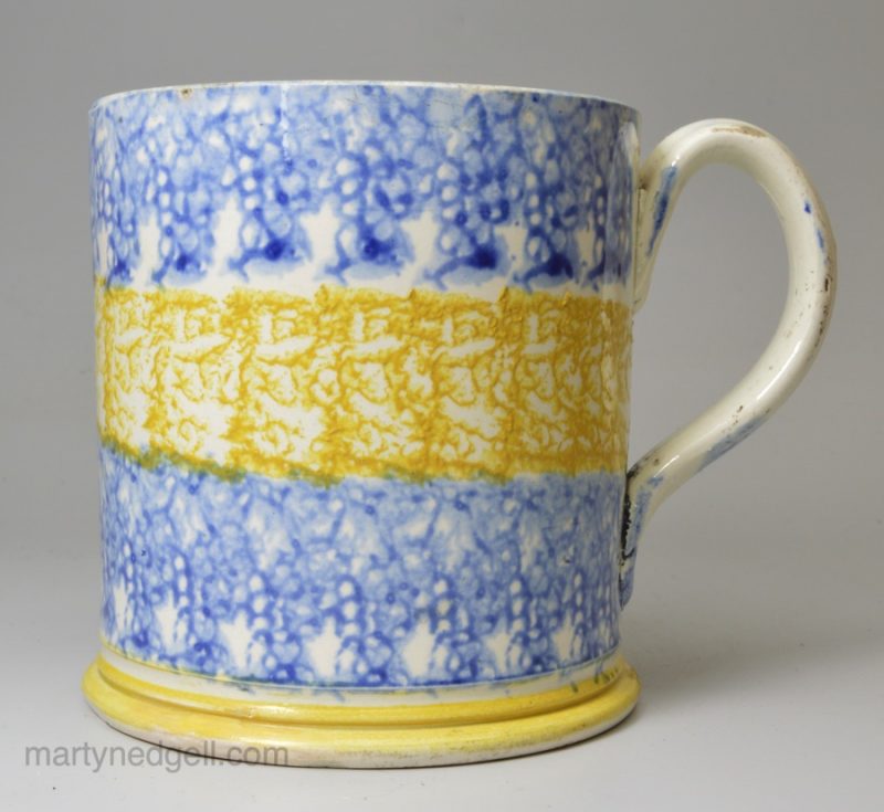 Pearlware pottery mug with bright sponge decoration, circa 1820