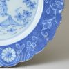 London delft plate decorated with powder blue ground, circa 1750